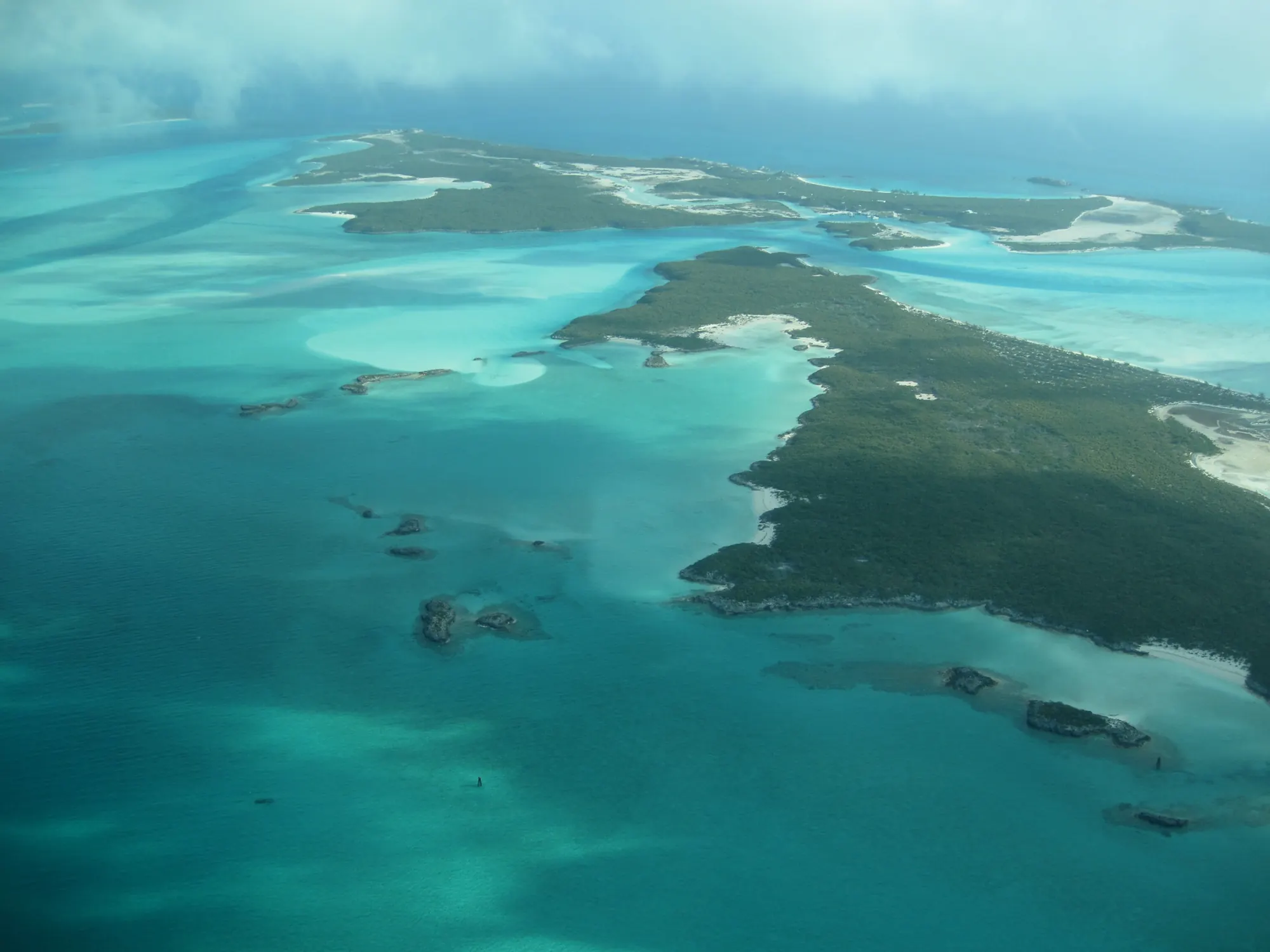 Turquoise shallows and cays seen from the air over The Bahamas